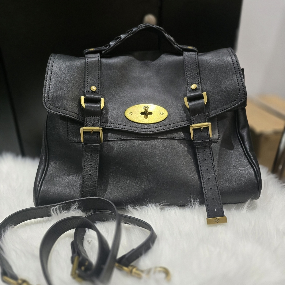 Elegant Black and Gold Leather Satchel with Structured Design
